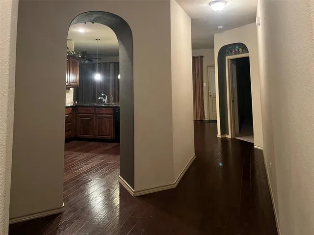 a view of a livingroom with wooden floor