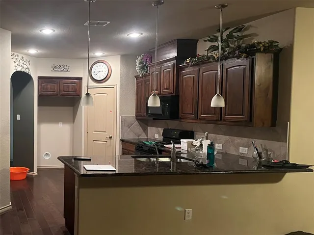 a room with lots of wooden furniture