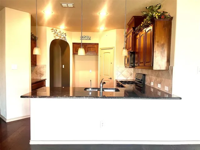 a bathroom with a sink mirror and vanity