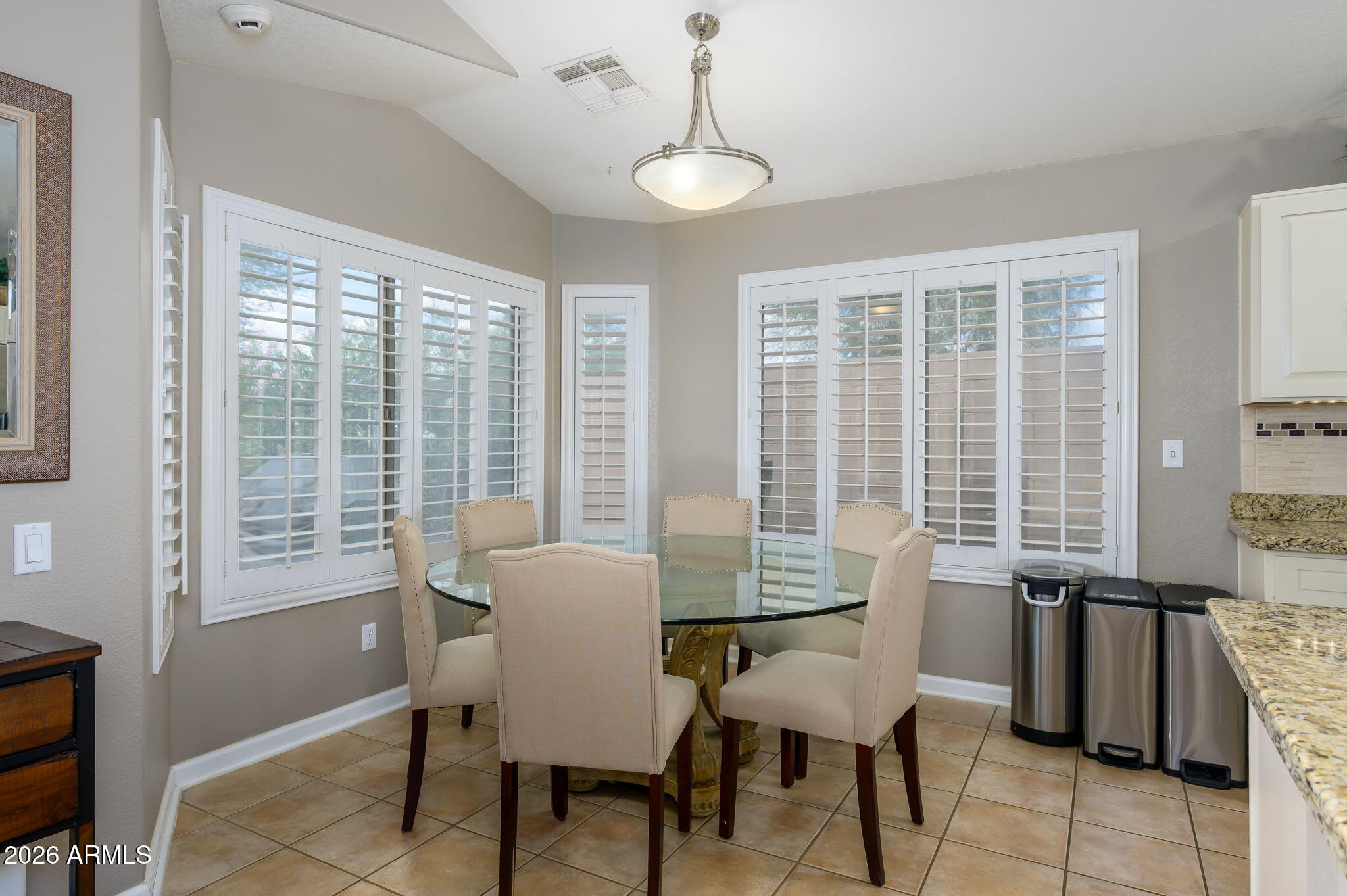 3136 East Roveen Avenue Phoenix, AZ 85032 - Photo 12 of 38 a view of a dining room with furniture window and outside view