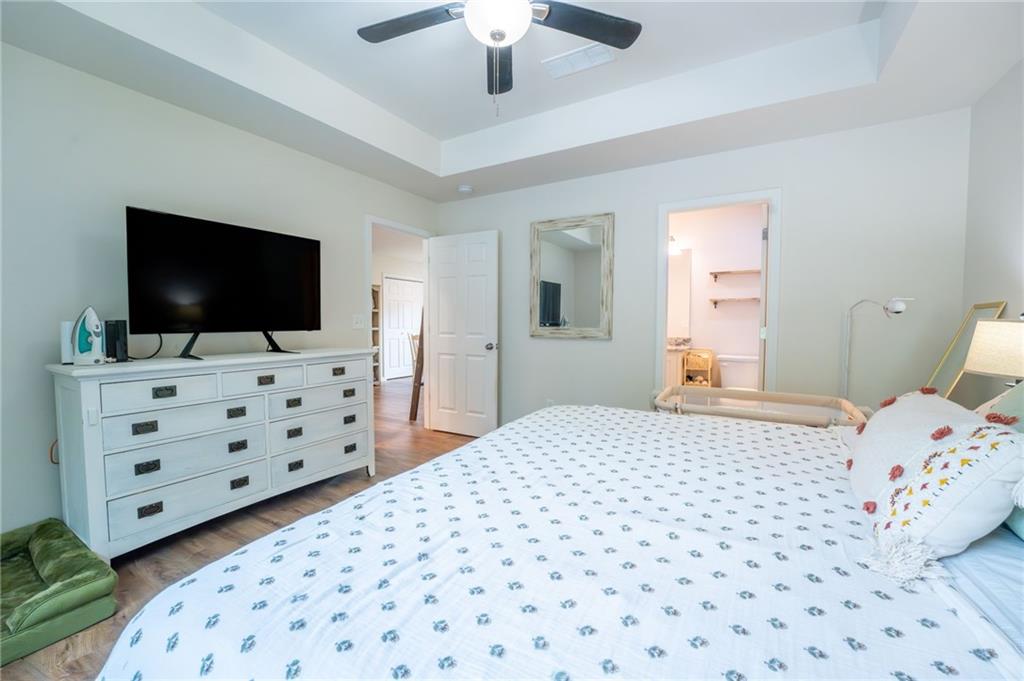 118 Wash Rider Road Dahlonega, GA 30533 - Photo 23 of 37 a bedroom with a bed and a flat screen tv