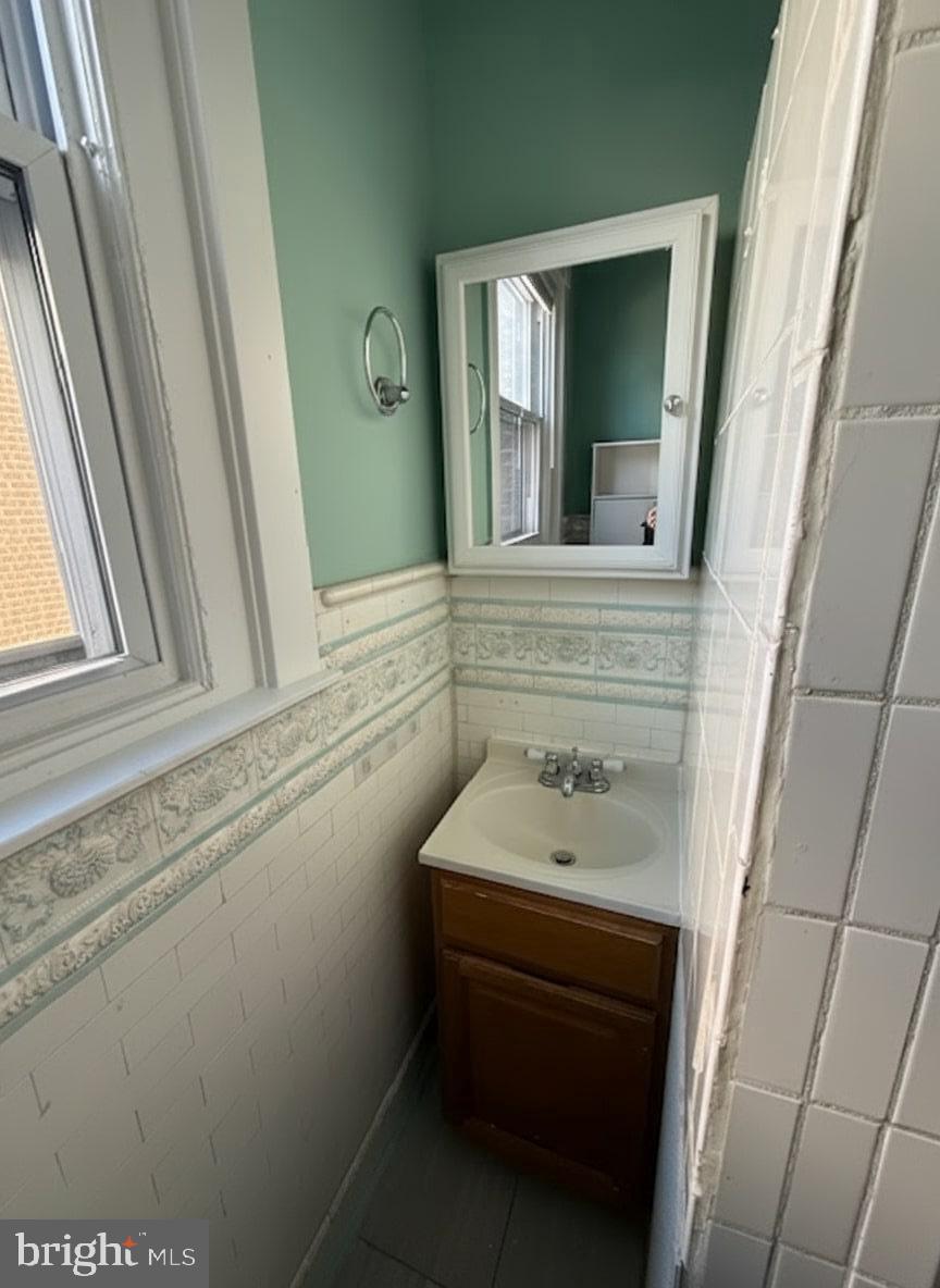 605 West Olney Avenue, Unit 2 Philadelphia, PA 19120 - Photo 10 of 11 a bathroom with a sink and a mirror