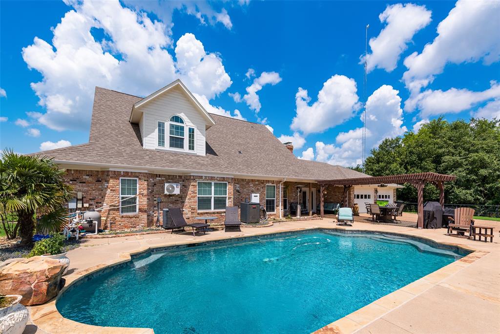 669 VZ County Road Canton, TX 75103 - Photo 9 of 40 a front view of a house with swimming pool garden and patio