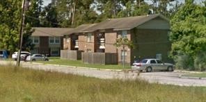 a house view with a swimming pool and sitting space