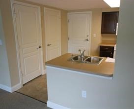36409 Cane Market Road, Unit 32 Denham Springs, LA 70706 - Photo 4 of 6 a bathroom with a sink and a mirror