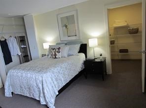 36409 Cane Market Road, Unit 32 Denham Springs, LA 70706 - Photo 6 of 6 a bedroom with a bed and a lamp on the dresser