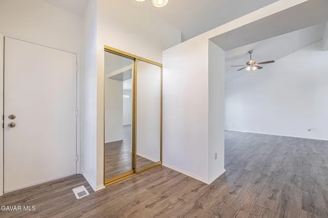 an empty room with wooden floor