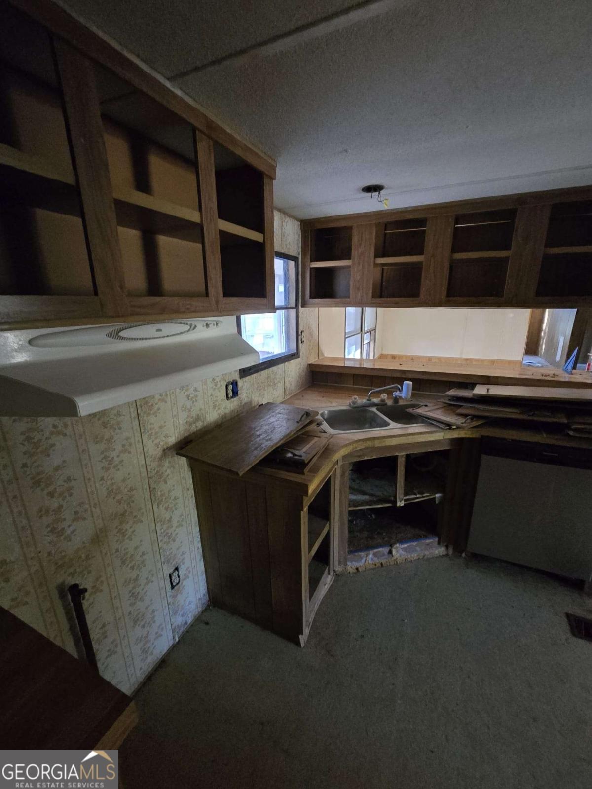211 Waycross Road Savannah, GA 31419 - Photo 4 of 8 a kitchen with stainless steel appliances a stove and a microwave
