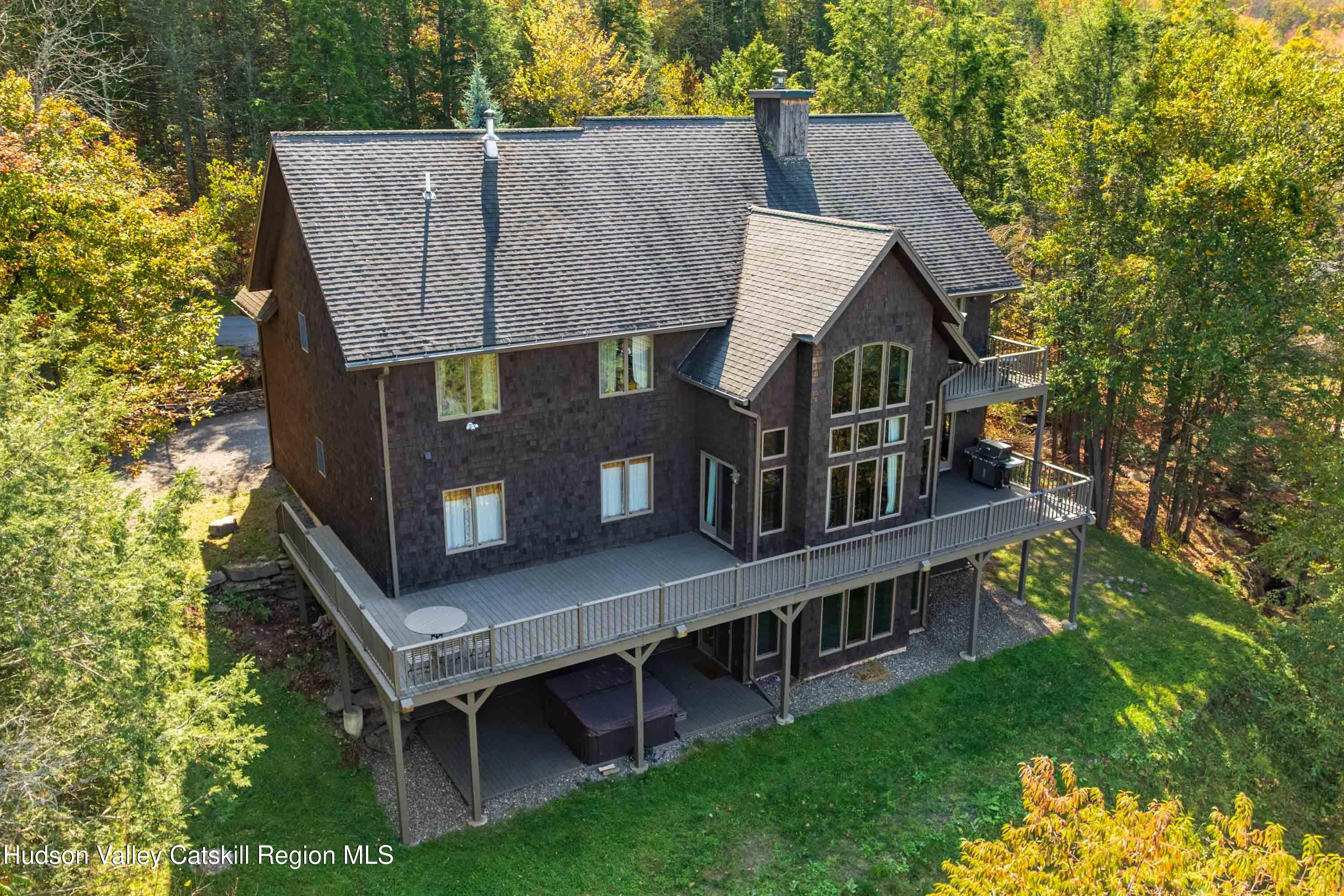 aerial view of a house with roof deck front of house