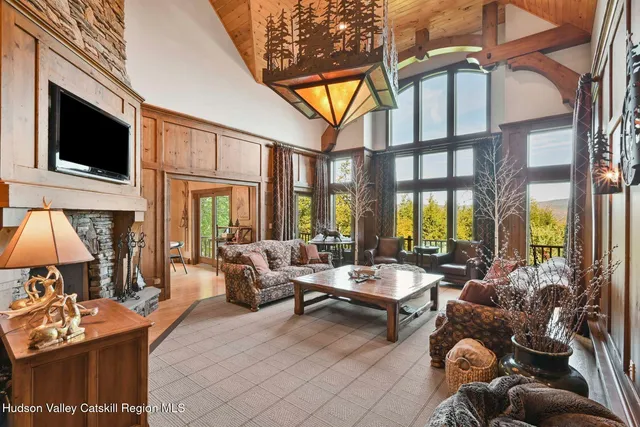 a living room with fireplace furniture and a flat screen tv