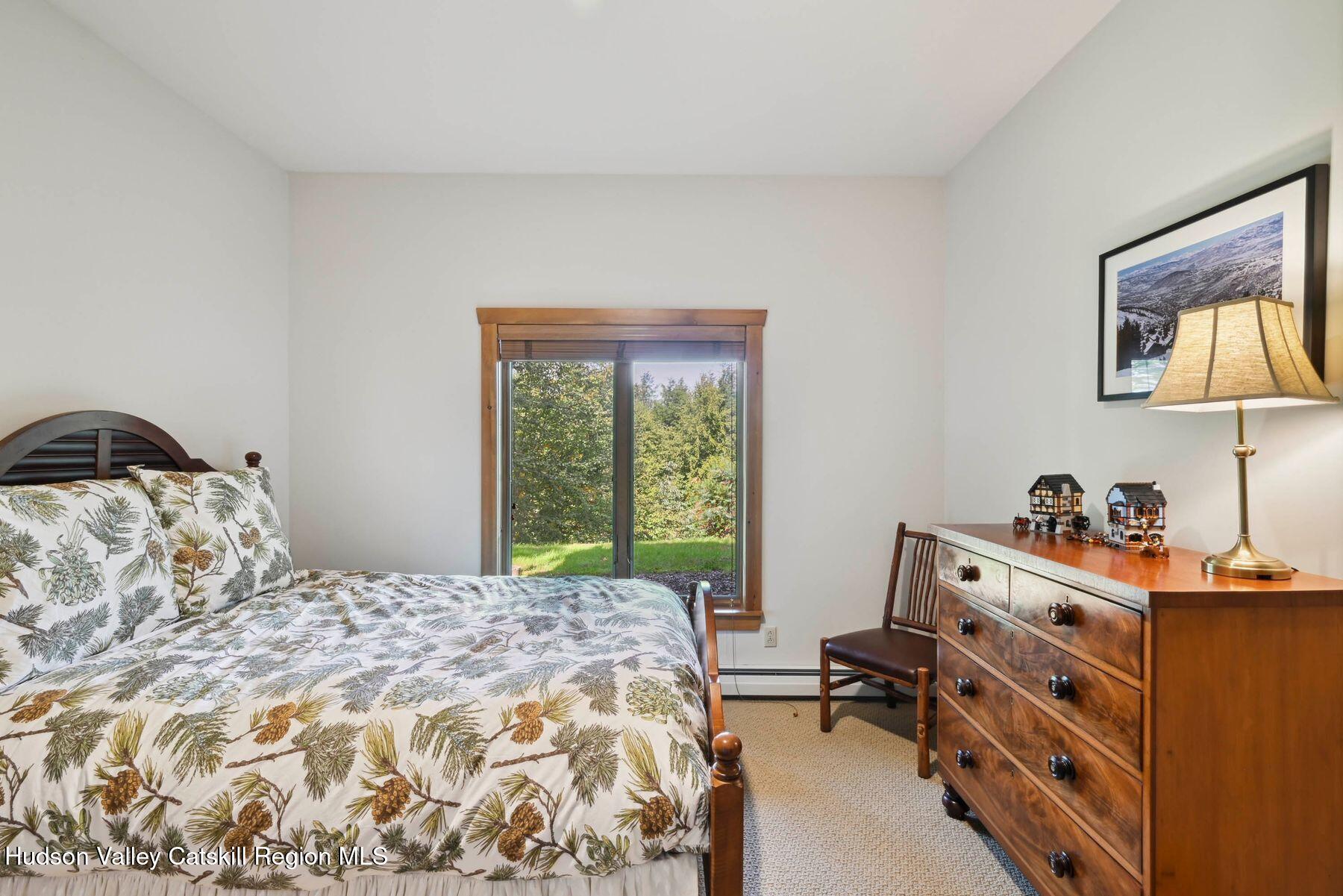 19 Twin Maples Lane Windham, NY 12496 - Photo 33 of 109 a bedroom with a bed and a window