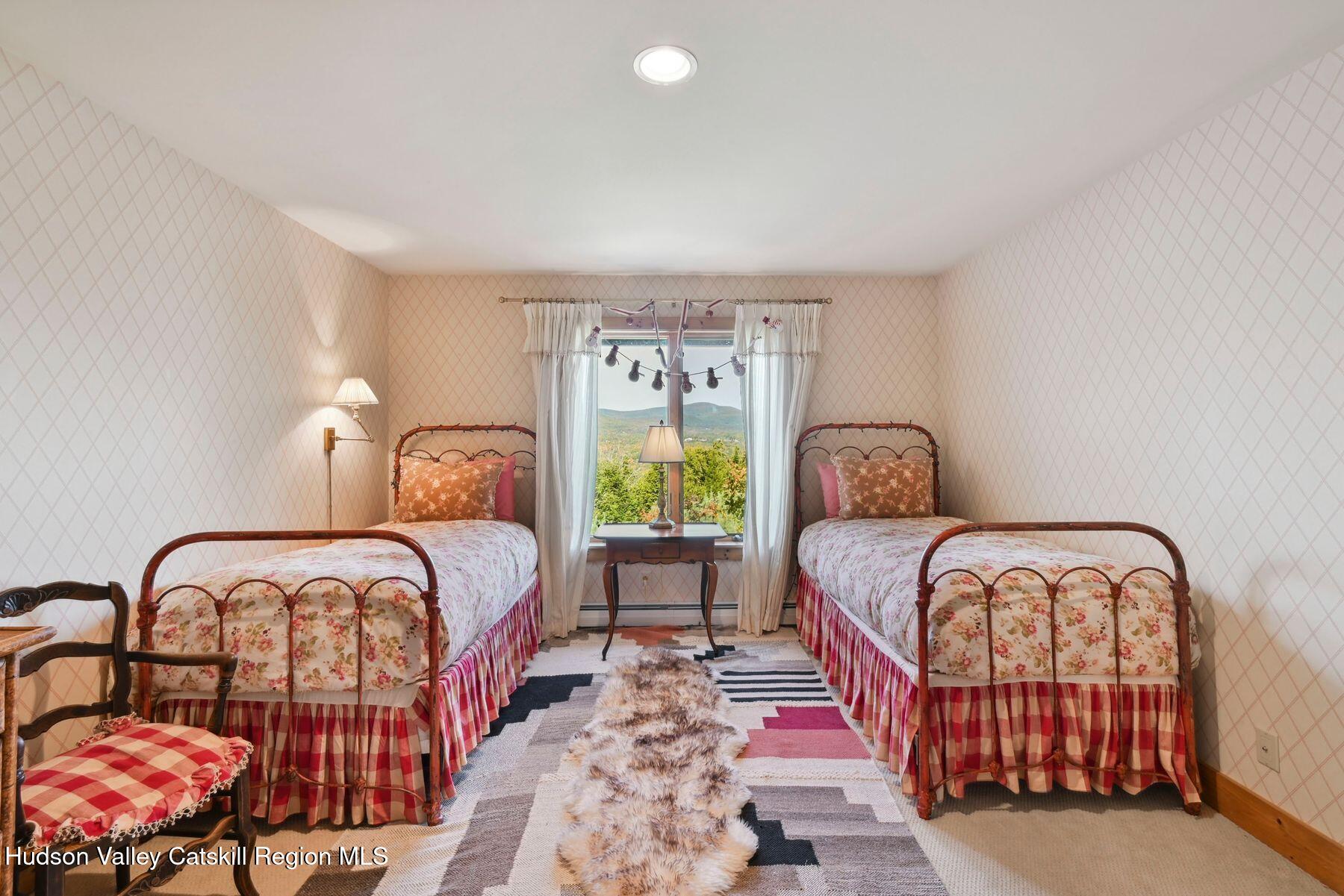 19 Twin Maples Lane Windham, NY 12496 - Photo 48 of 109 a bedroom with two beds and window