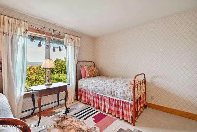 a bathroom with a toilet a sink and shower