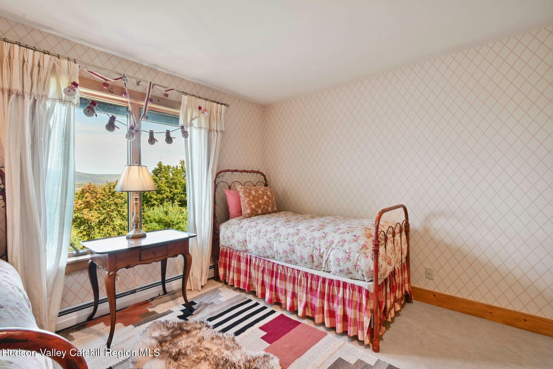 19 Twin Maples Lane Windham, NY 12496 - Photo 49 of 109 a bedroom with furniture and a window