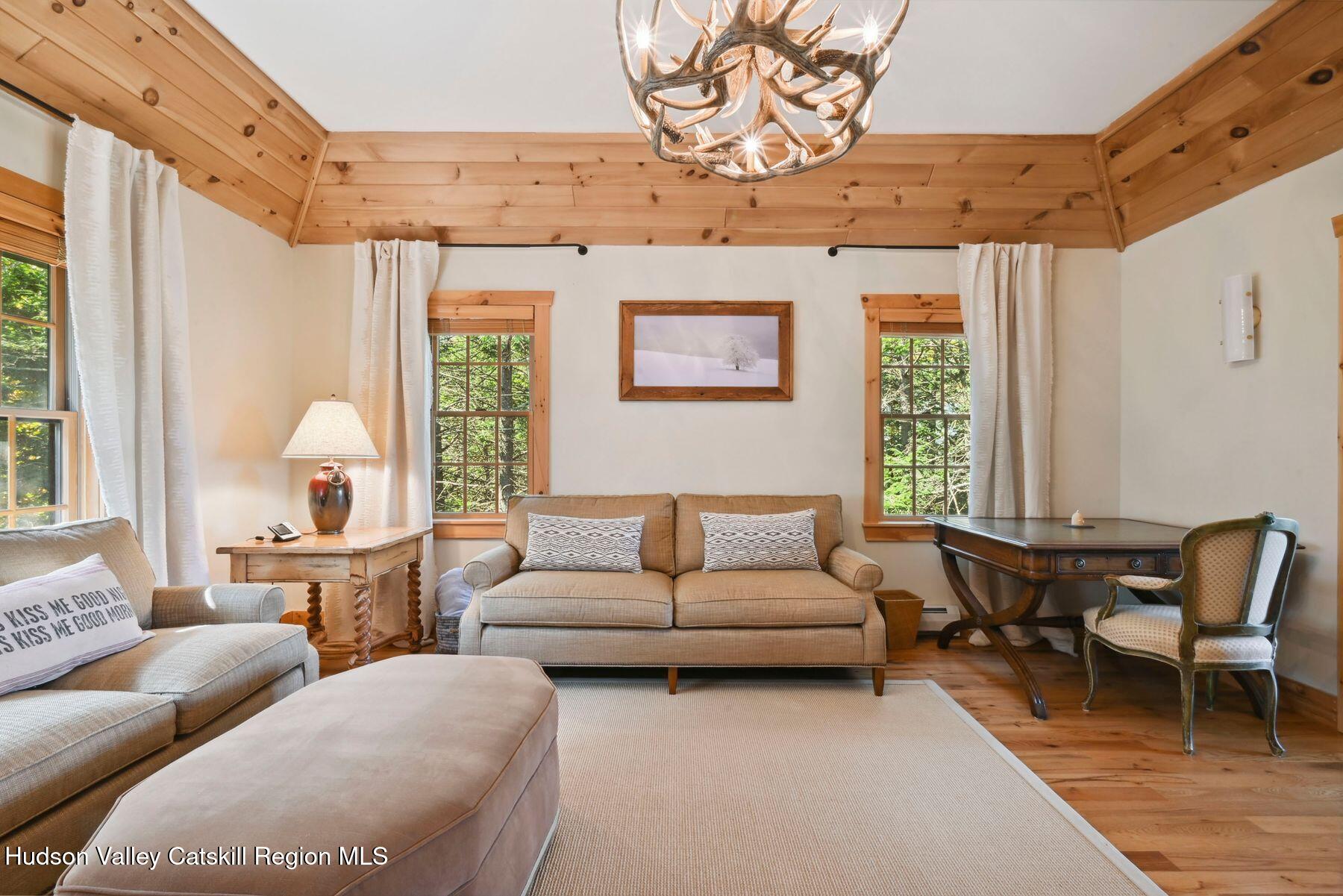 19 Twin Maples Lane Windham, NY 12496 - Photo 53 of 109 a living room with furniture and a large window