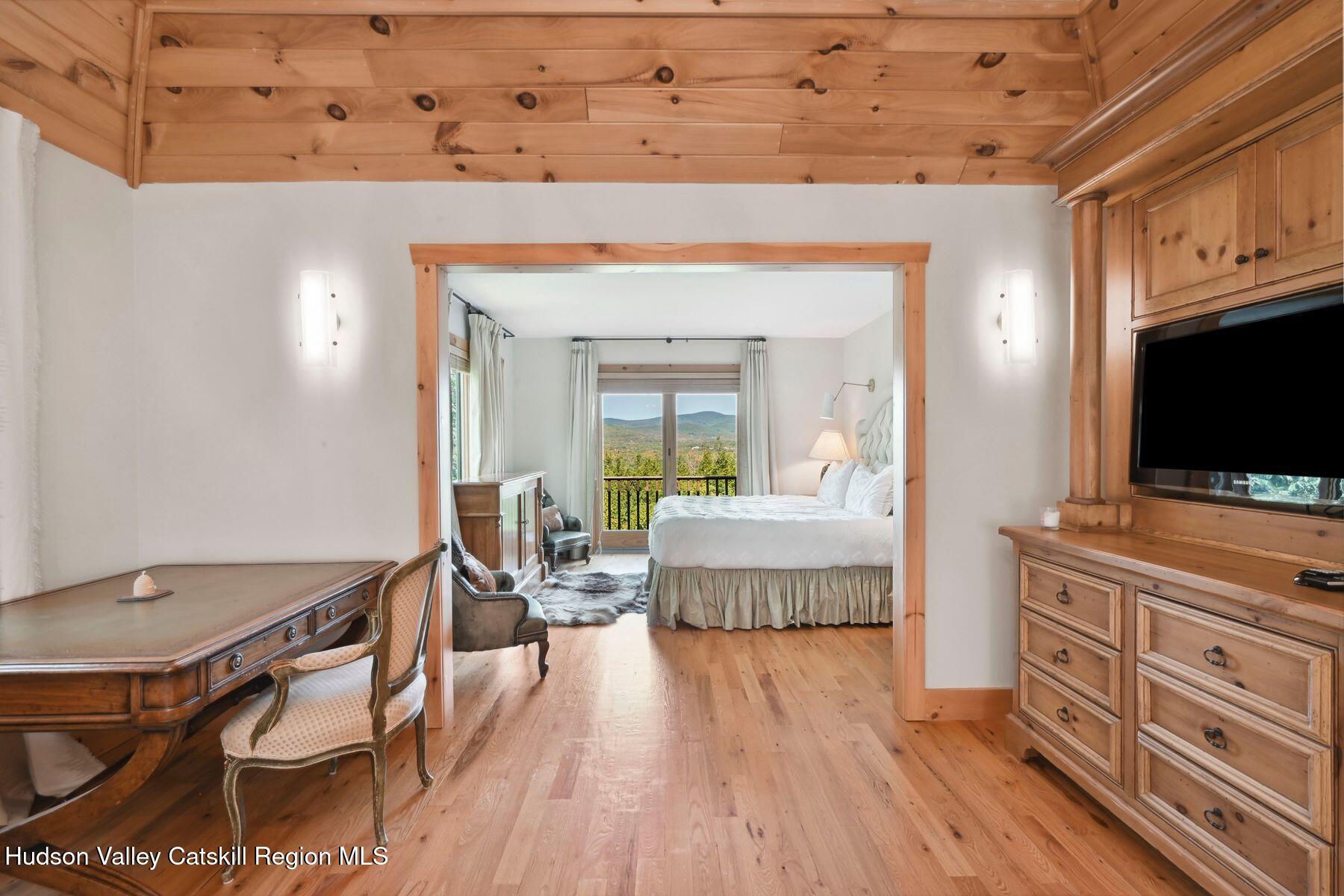 19 Twin Maples Lane Windham, NY 12496 - Photo 58 of 109 a living room with furniture and a flat screen tv