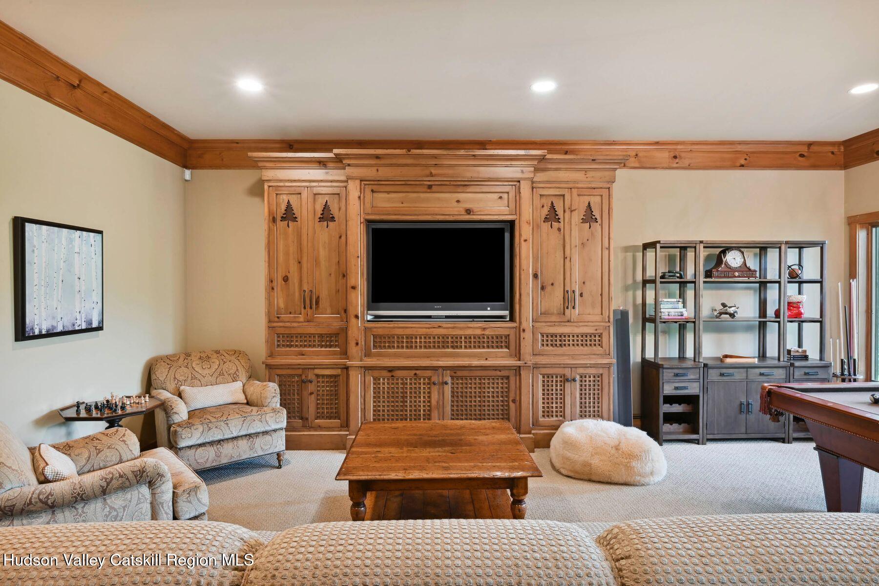 19 Twin Maples Lane Windham, NY 12496 - Photo 60 of 109 a living room with furniture and a flat screen tv