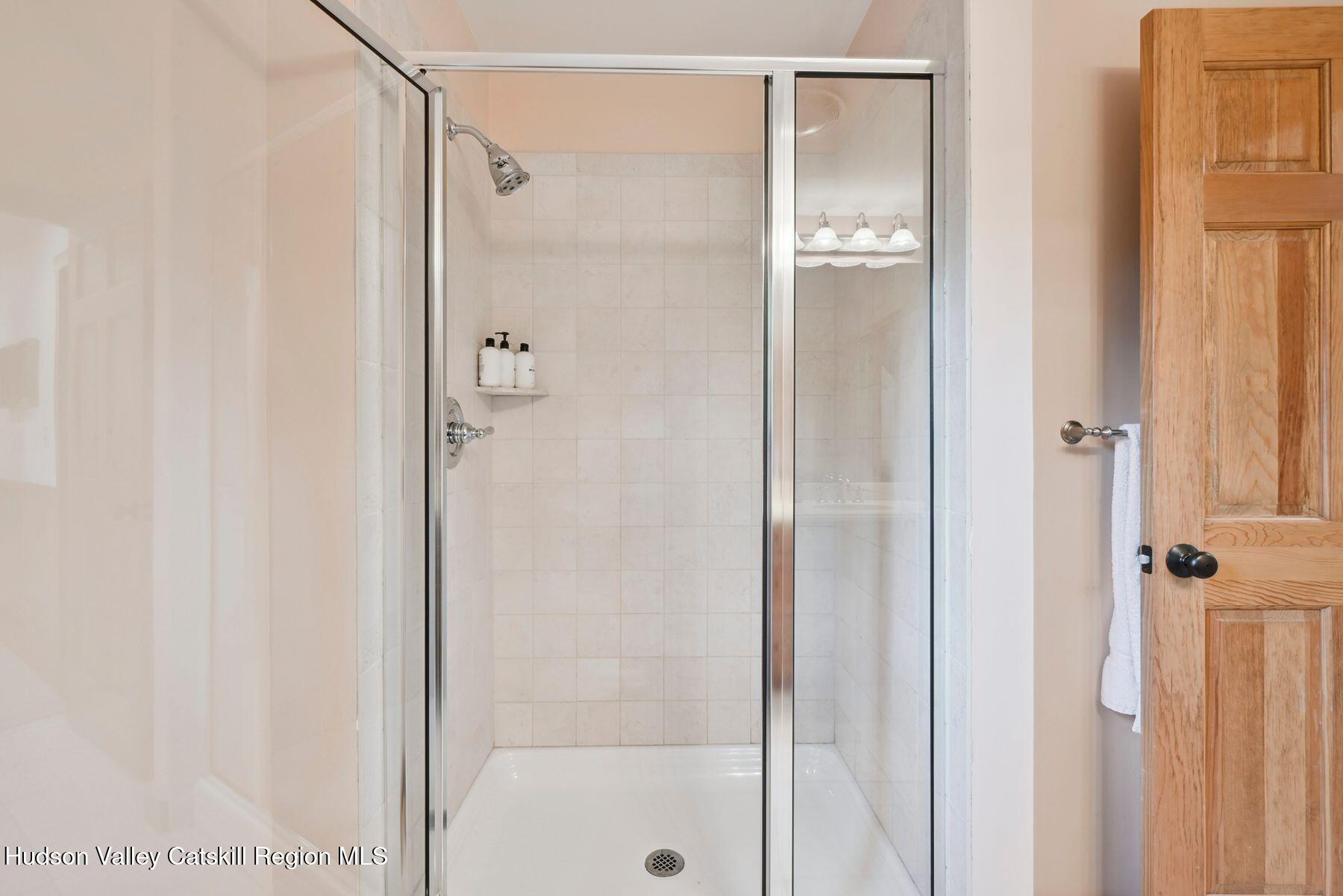 19 Twin Maples Lane Windham, NY 12496 - Photo 82 of 109 a bathroom with a glass shower door
