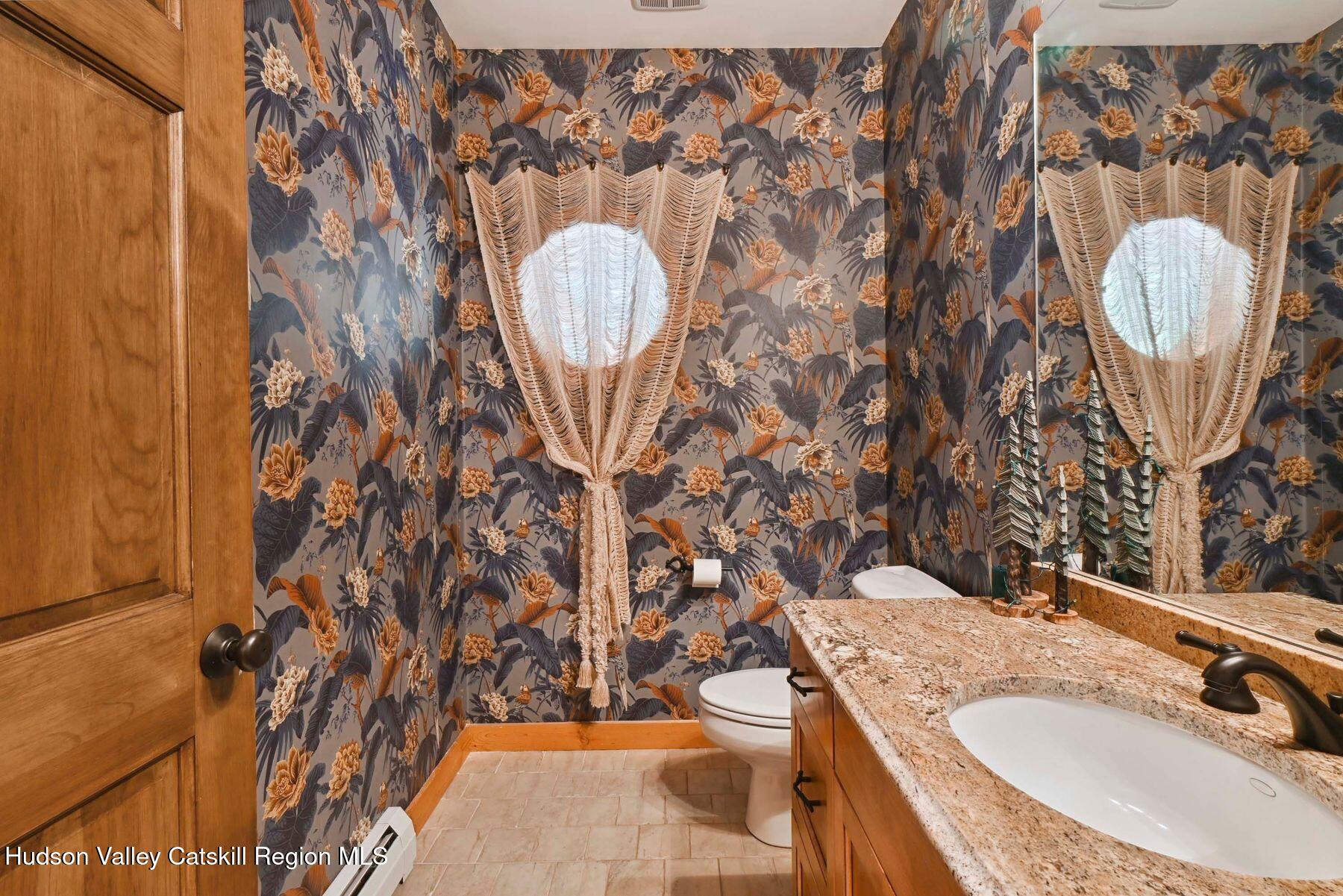 19 Twin Maples Lane Windham, NY 12496 - Photo 83 of 109 a bathroom with a granite countertop sink and a mirror