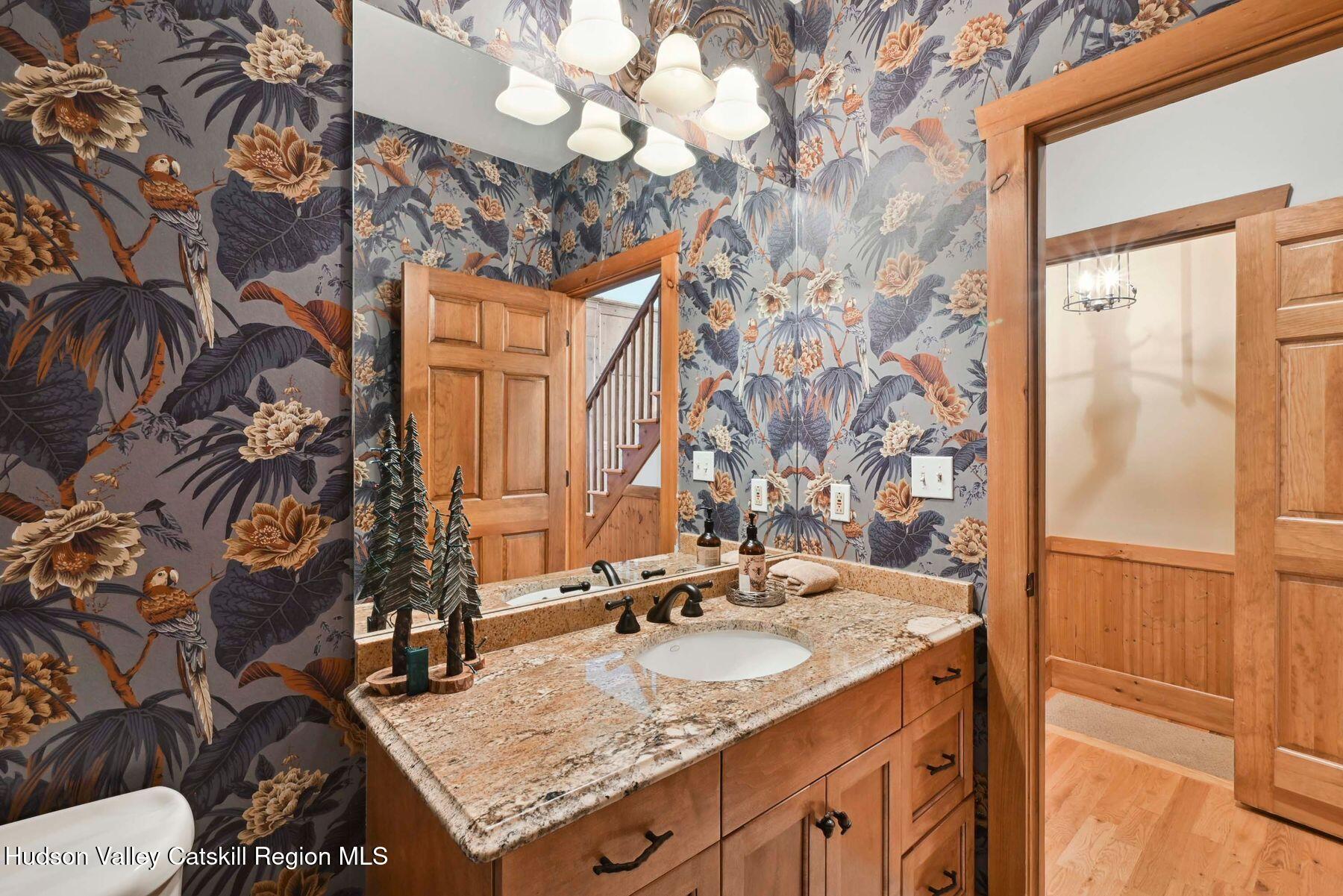 19 Twin Maples Lane Windham, NY 12496 - Photo 85 of 109 a bathroom with a granite countertop sink and a mirror