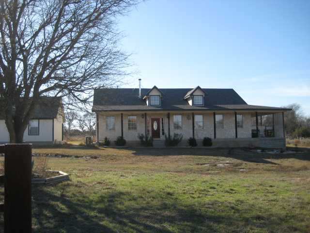 221 Chaparral Road Georgetown, TX 78628 - Photo 1 of 1 a front view of a house with a yard