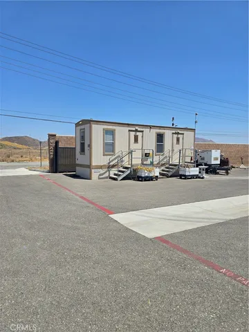 a view of a kitchen with a sink and cabinets