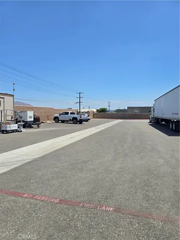 a view of a street with an cars parked