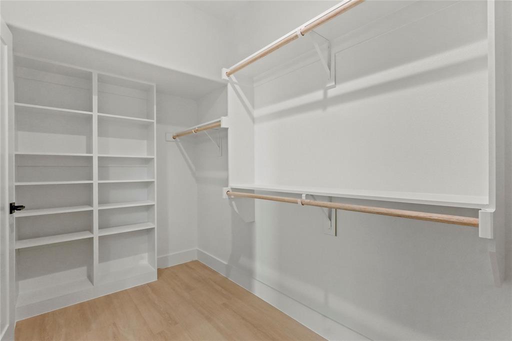 1823 Pollard Street Dallas, TX 75208 - Photo 19 of 28 Spacious closet featuring light wood-style floors