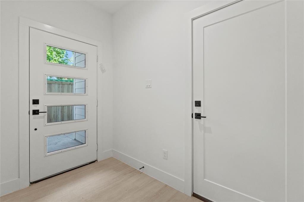 1823 Pollard Street Dallas, TX 75208 - Photo 2 of 28 Foyer entrance featuring light wood-style flooring and baseboards