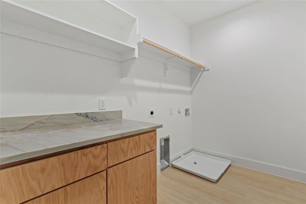 1823 Pollard Street Dallas, TX 75208 - Photo 21 of 28 Washroom with hookup for an electric dryer, light wood-style flooring, and hookup for a gas dryer