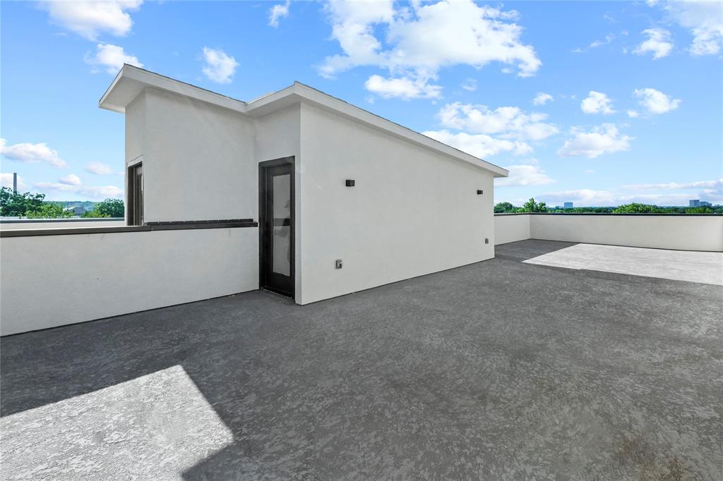 1823 Pollard Street Dallas, TX 75208 - Photo 24 of 28 Back of house with a patio and stucco siding