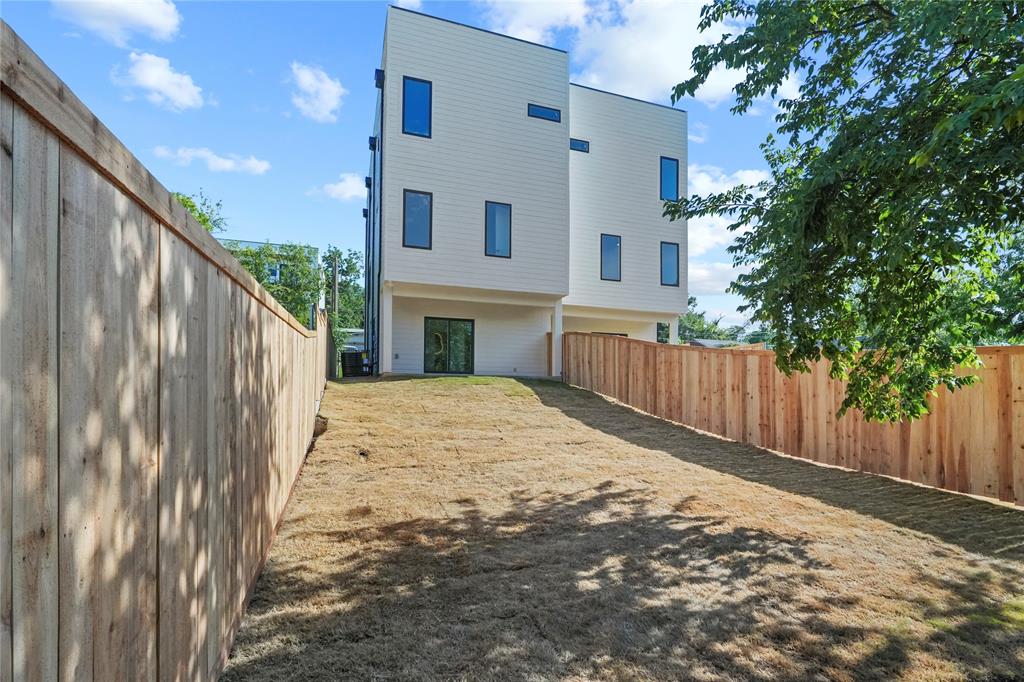 1823 Pollard Street Dallas, TX 75208 - Photo 27 of 28 Back of property featuring a fenced backyard