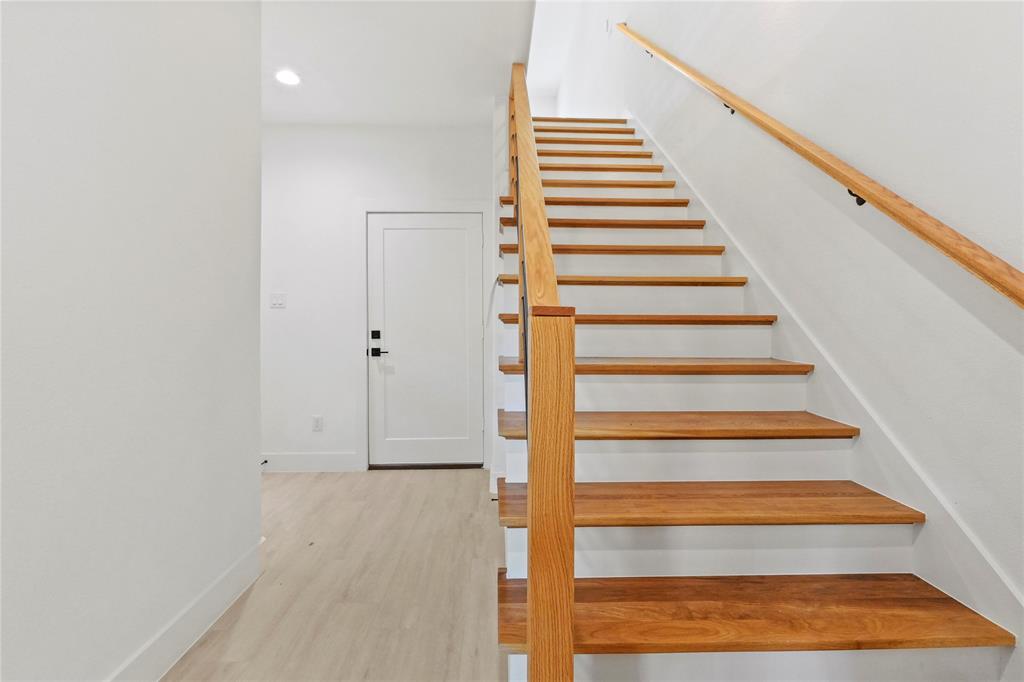 1823 Pollard Street Dallas, TX 75208 - Photo 3 of 28 Staircase with wood finished floors and recessed lighting