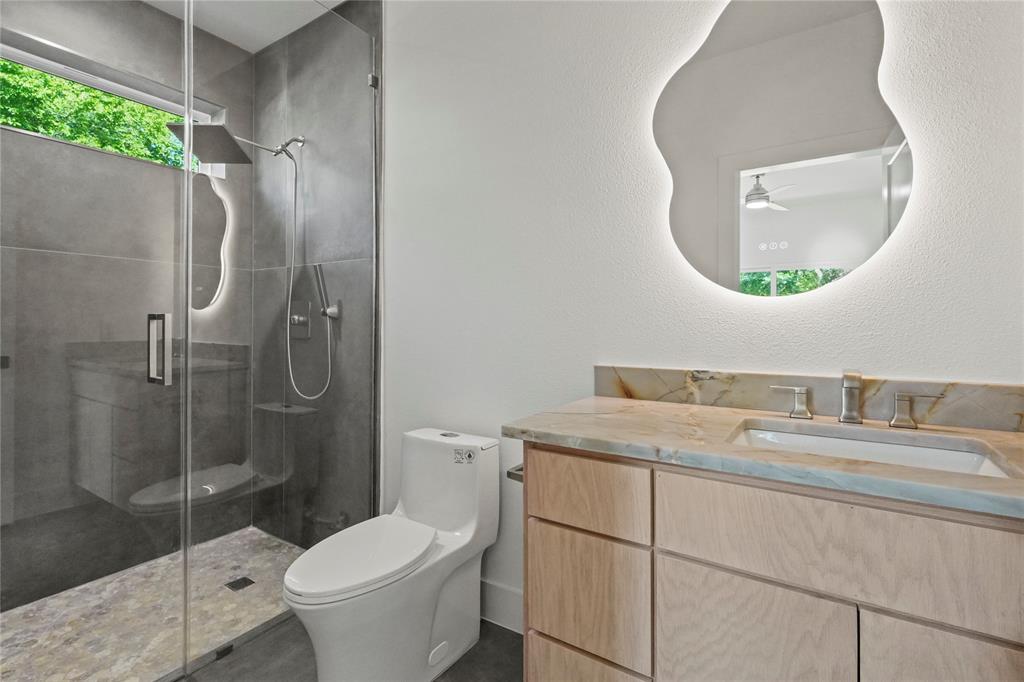 1823 Pollard Street Dallas, TX 75208 - Photo 6 of 28 Full bathroom featuring vanity, a stall shower, and ceiling fan