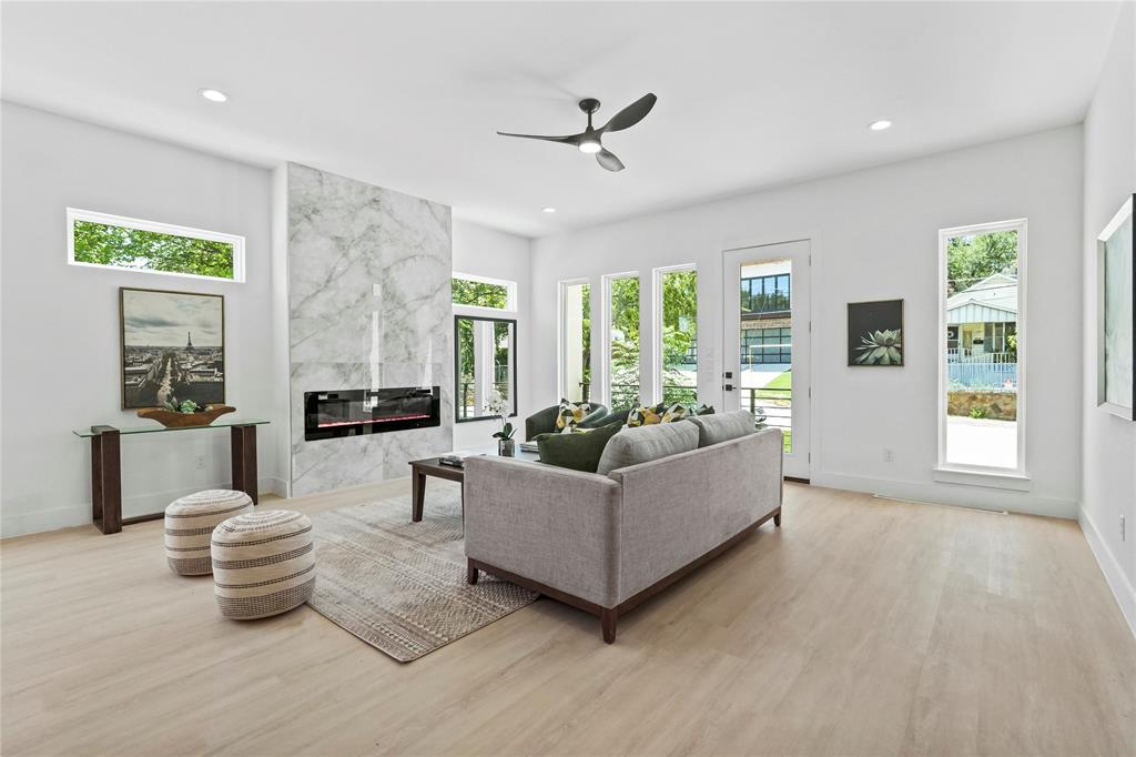 1823 Pollard Street Dallas, TX 75208 - Photo 7 of 28 Living room featuring a fireplace, recessed lighting, a ceiling fan, and light wood-style flooring