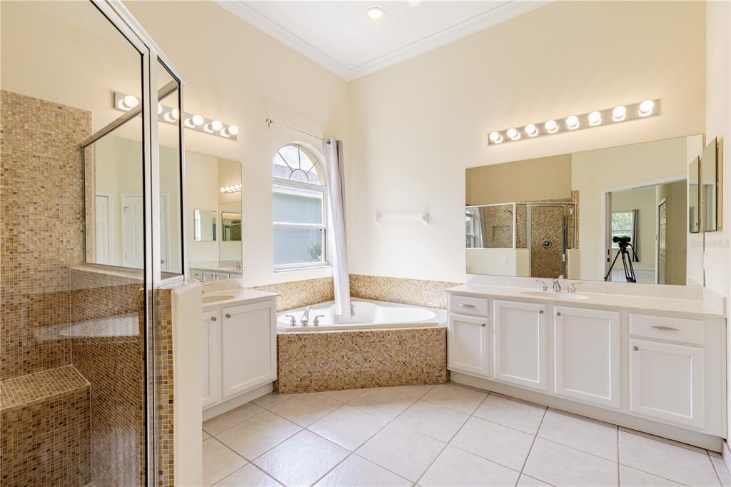 2718 Knightsbridge Road Clermont, FL 34711 - Photo 41 of 72 a spacious bathroom with a tub sink and mirror