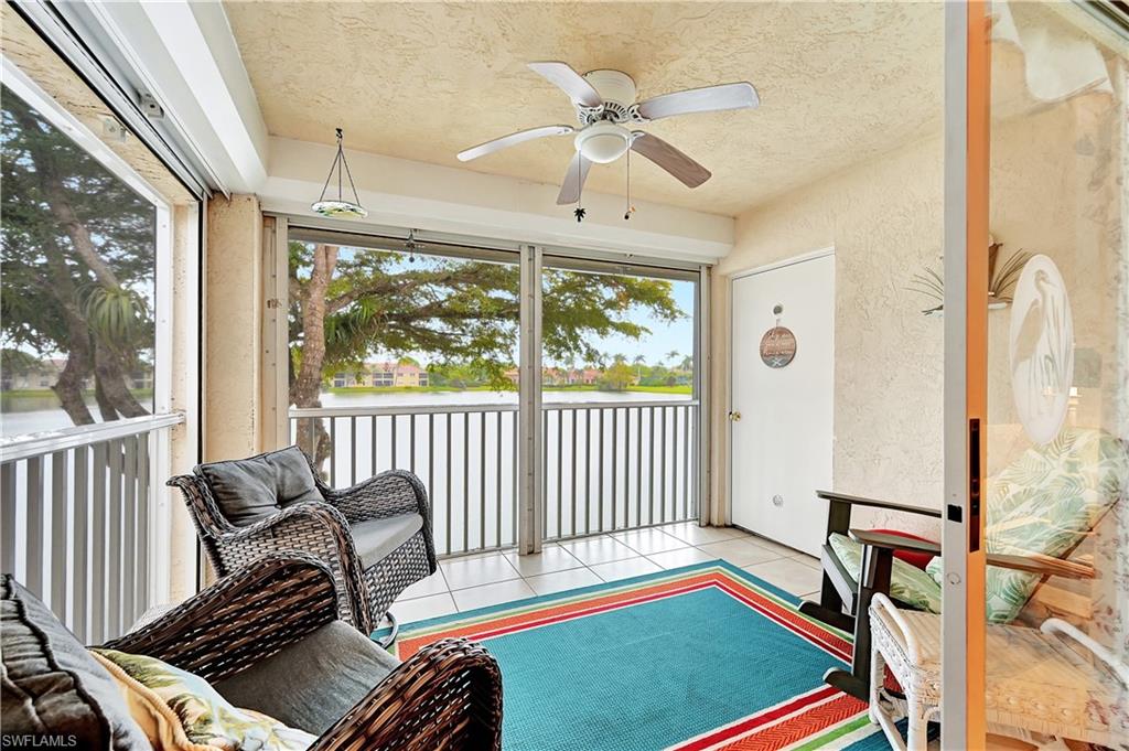 6496 Huntington Lakes Circle, Unit 201 Naples, FL 34119 - Photo 7 of 24 a bedroom with furniture and a window