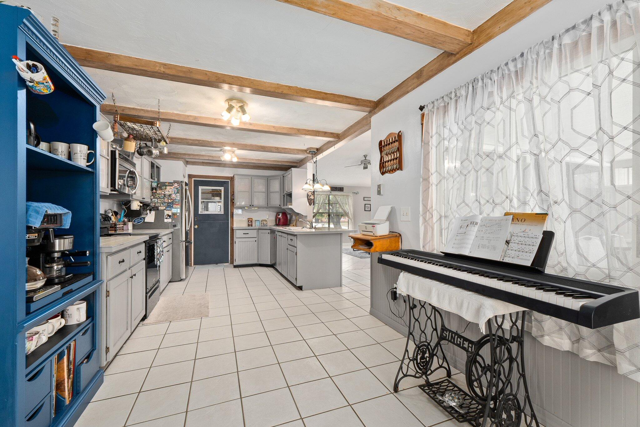 547 Southeast Cliff Road Port St. Lucie, FL 34984 - Photo 17 of 33 Kitchen / Garage Entrance