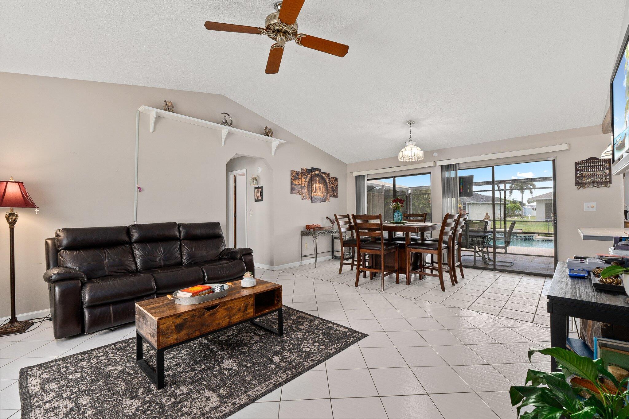 547 Southeast Cliff Road Port St. Lucie, FL 34984 - Photo 22 of 33 Living room view facing dining room