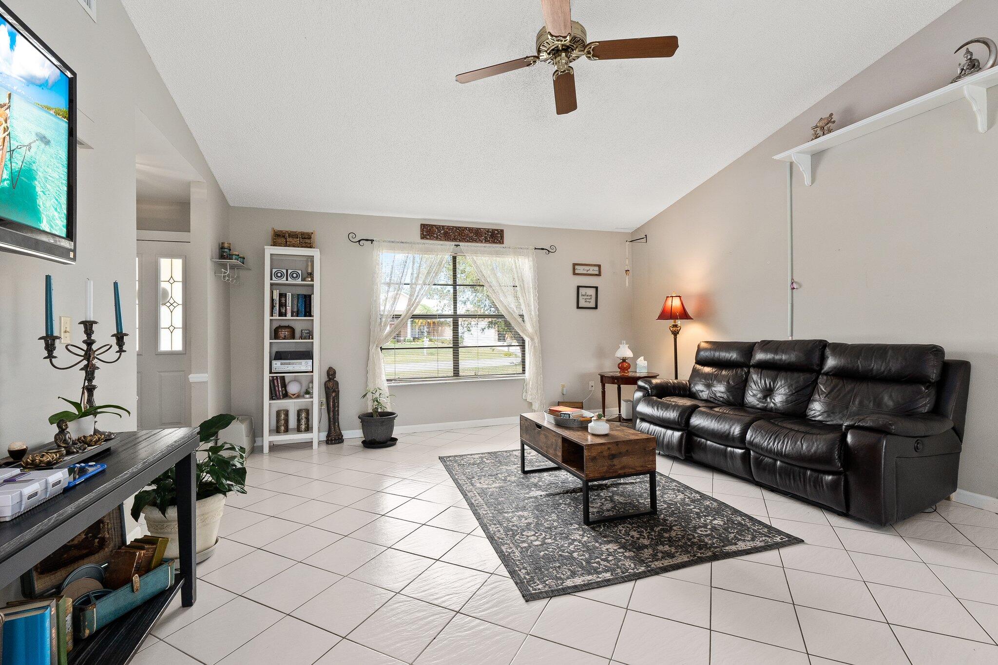 547 Southeast Cliff Road Port St. Lucie, FL 34984 - Photo 27 of 33 Living room facing front window