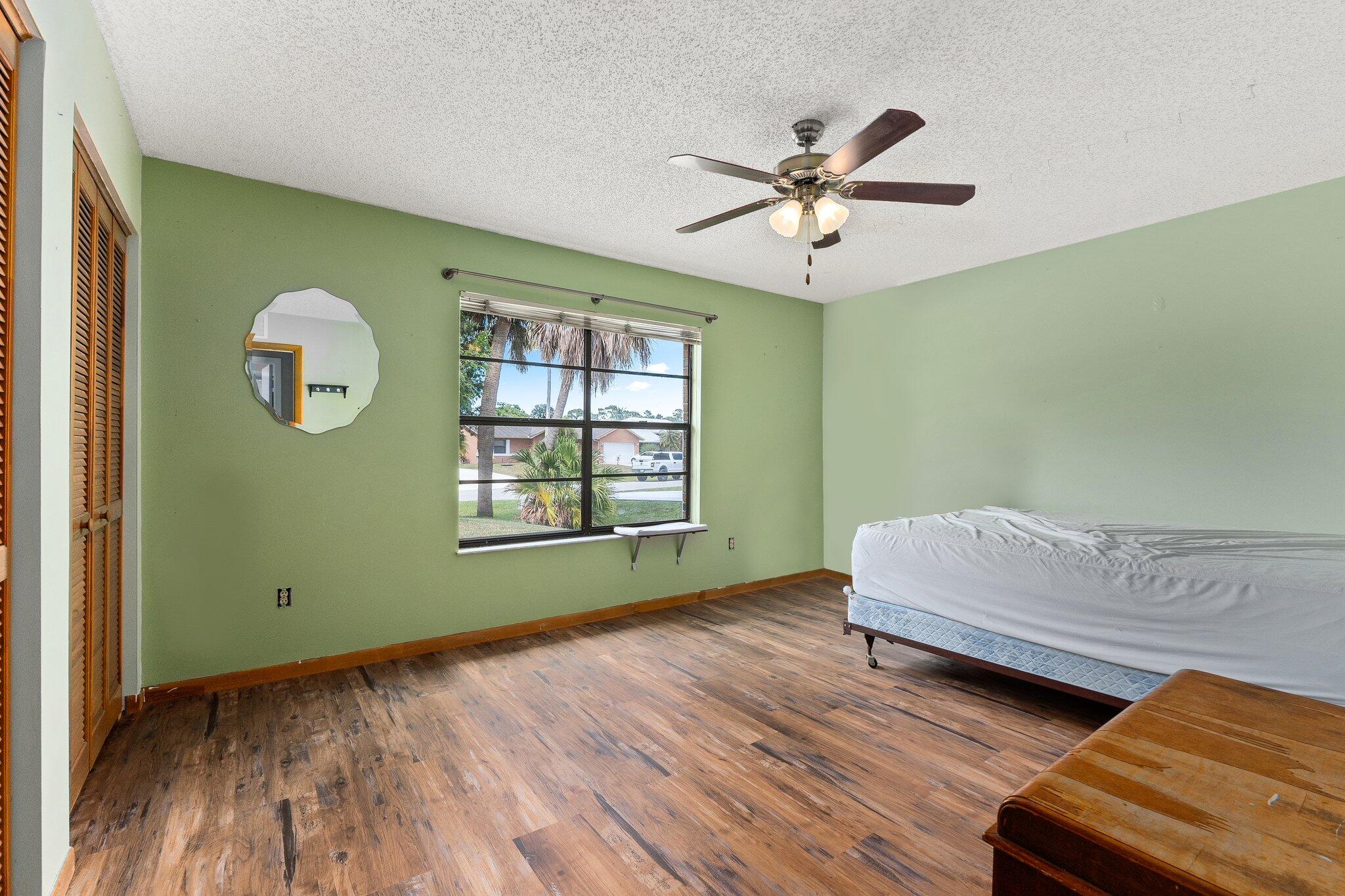 547 Southeast Cliff Road Port St. Lucie, FL 34984 - Photo 29 of 33 Bedroom 2 Front of house