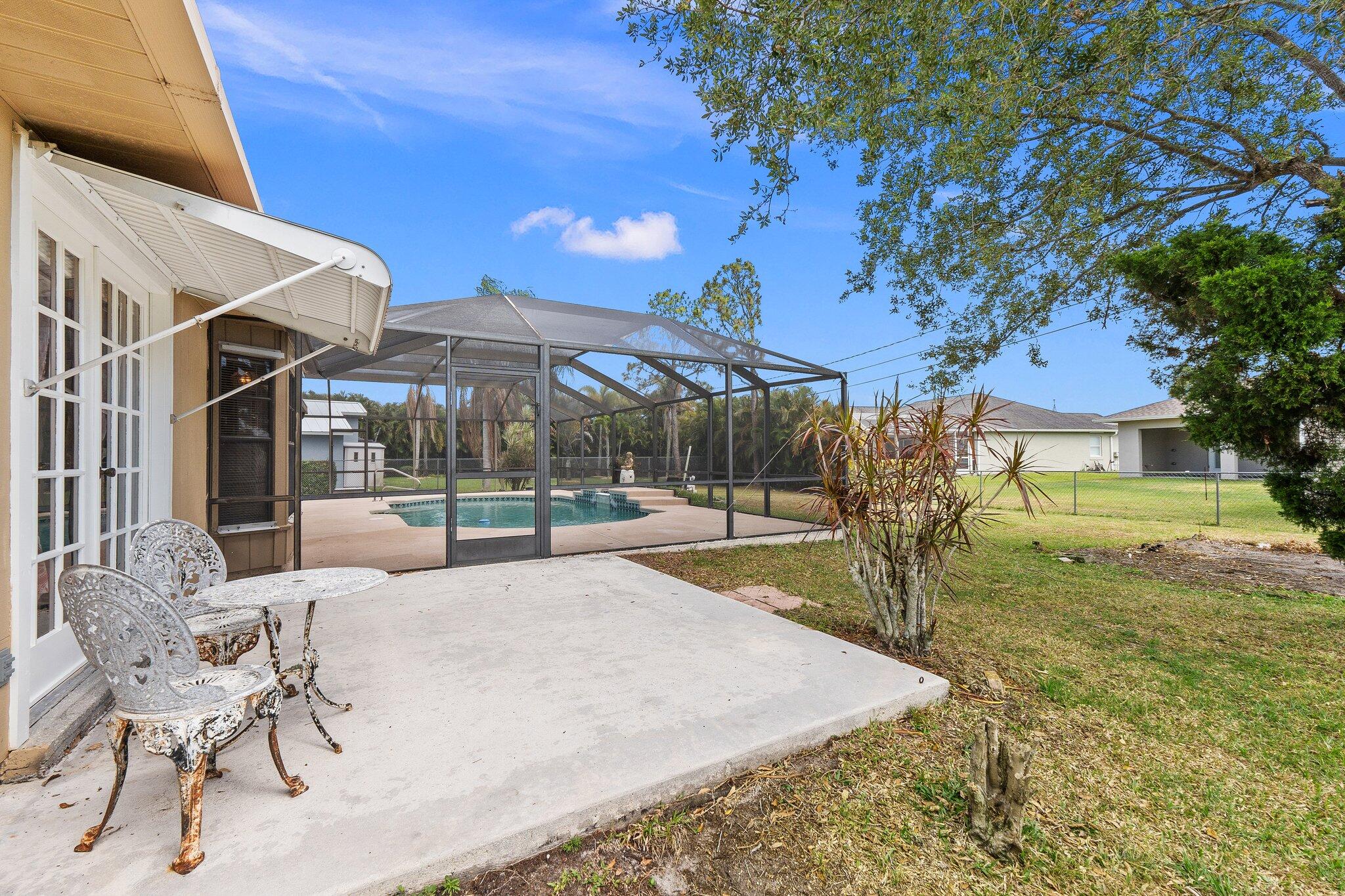 547 Southeast Cliff Road Port St. Lucie, FL 34984 - Photo 9 of 33 Primary Room Patio