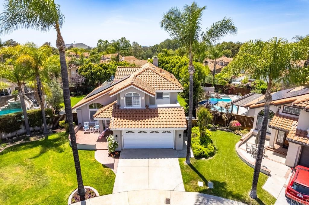 2 Tejon Rancho Santa Margarita, CA 92688 - Photo 1 of 1 a front view of a house with garden