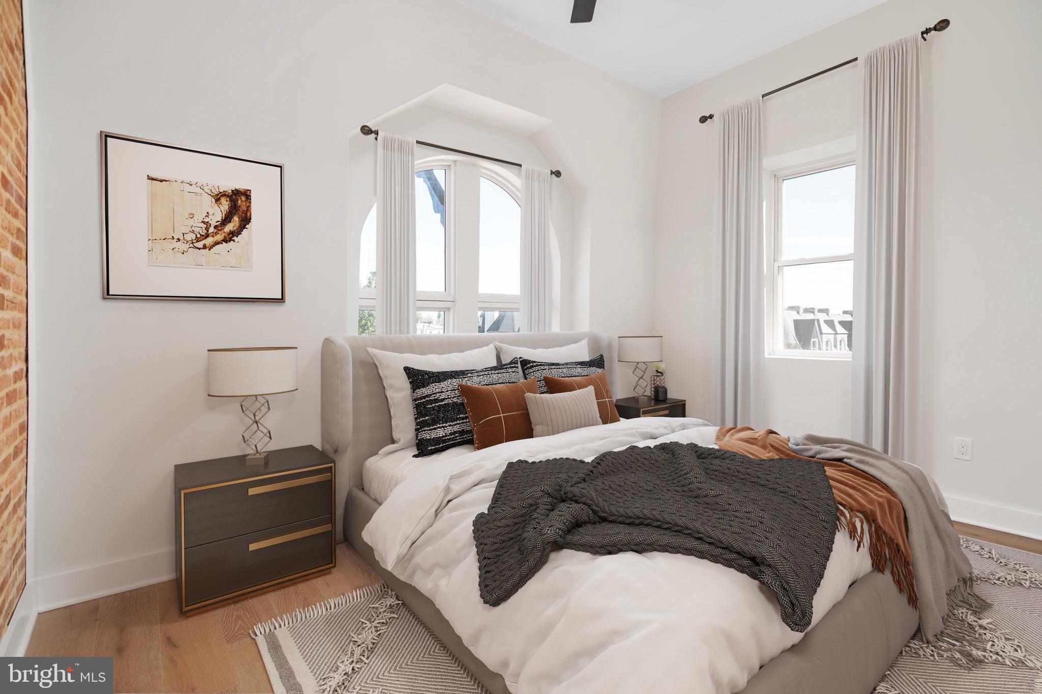 118 East 24th Street, Unit 3 Baltimore, MD 21218 - Photo 6 of 17 a bedroom with a bed and a window