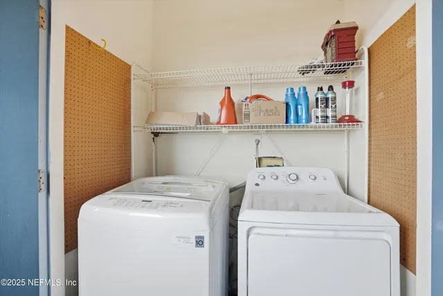 a utility room with dryer and washer