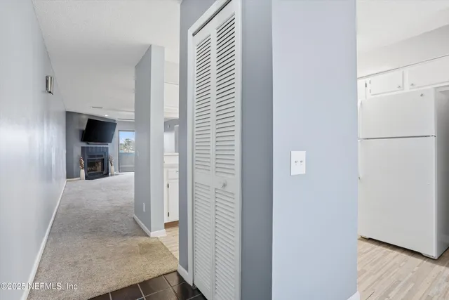 a view of hallway with wooden floor
