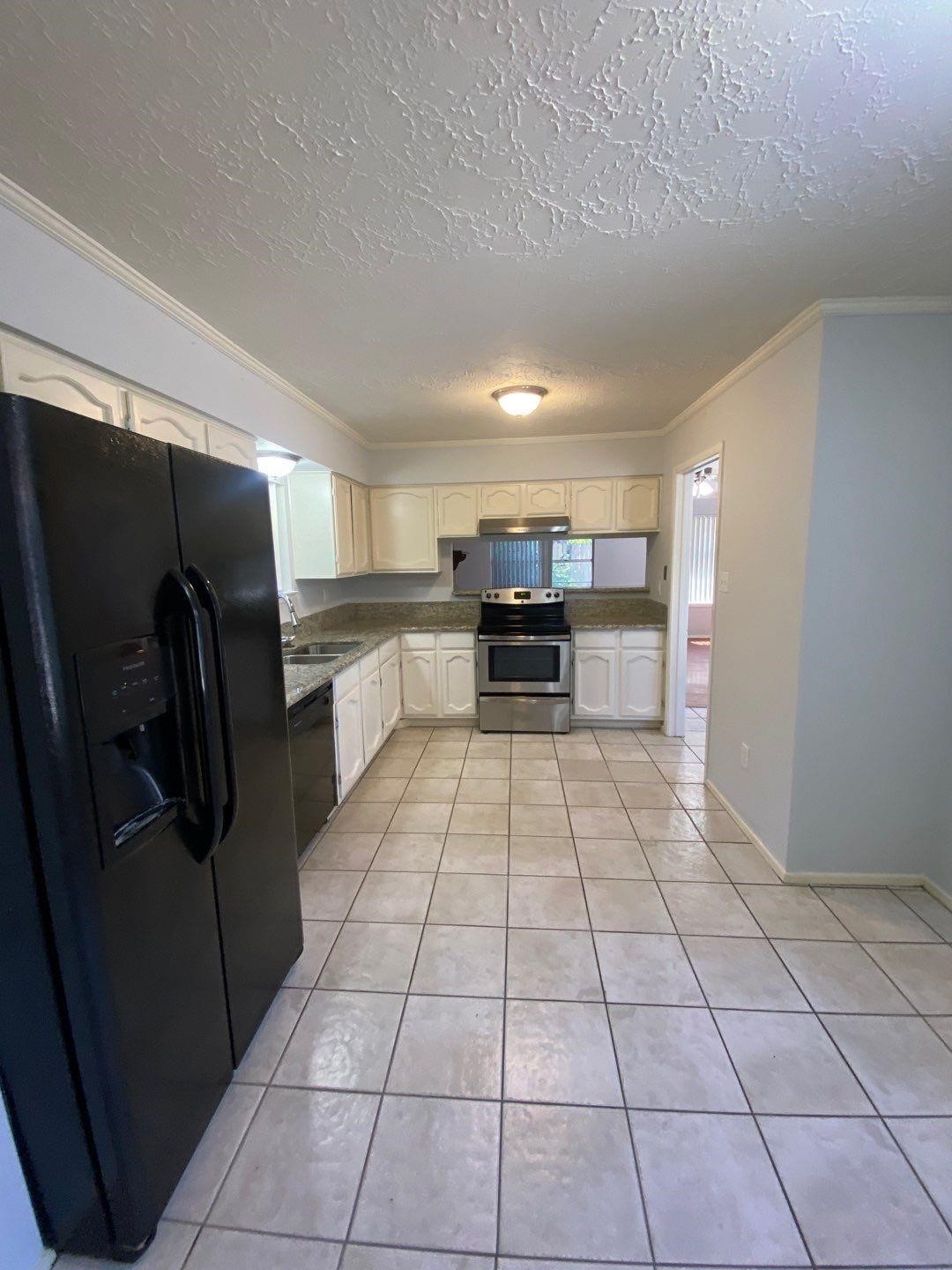 6406 Brookgate Drive Spring, TX 77373 - Photo 11 of 28 a view of kitchen with refrigerator cabinets and outdoor counter