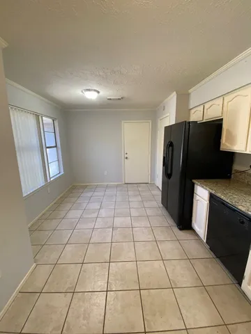 an empty room with a empty space and windows