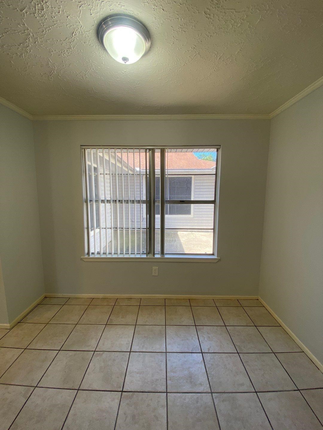 6406 Brookgate Drive Spring, TX 77373 - Photo 13 of 28 an empty room with a empty space and windows