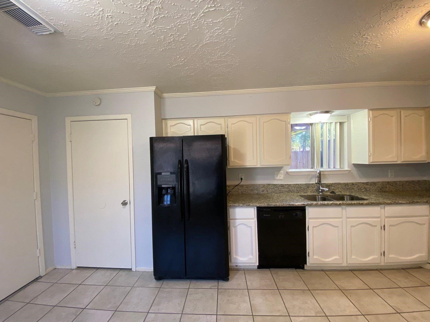 6406 Brookgate Drive Spring, TX 77373 - Photo 4 of 28 a kitchen with stainless steel appliances granite countertop a refrigerator and a sink